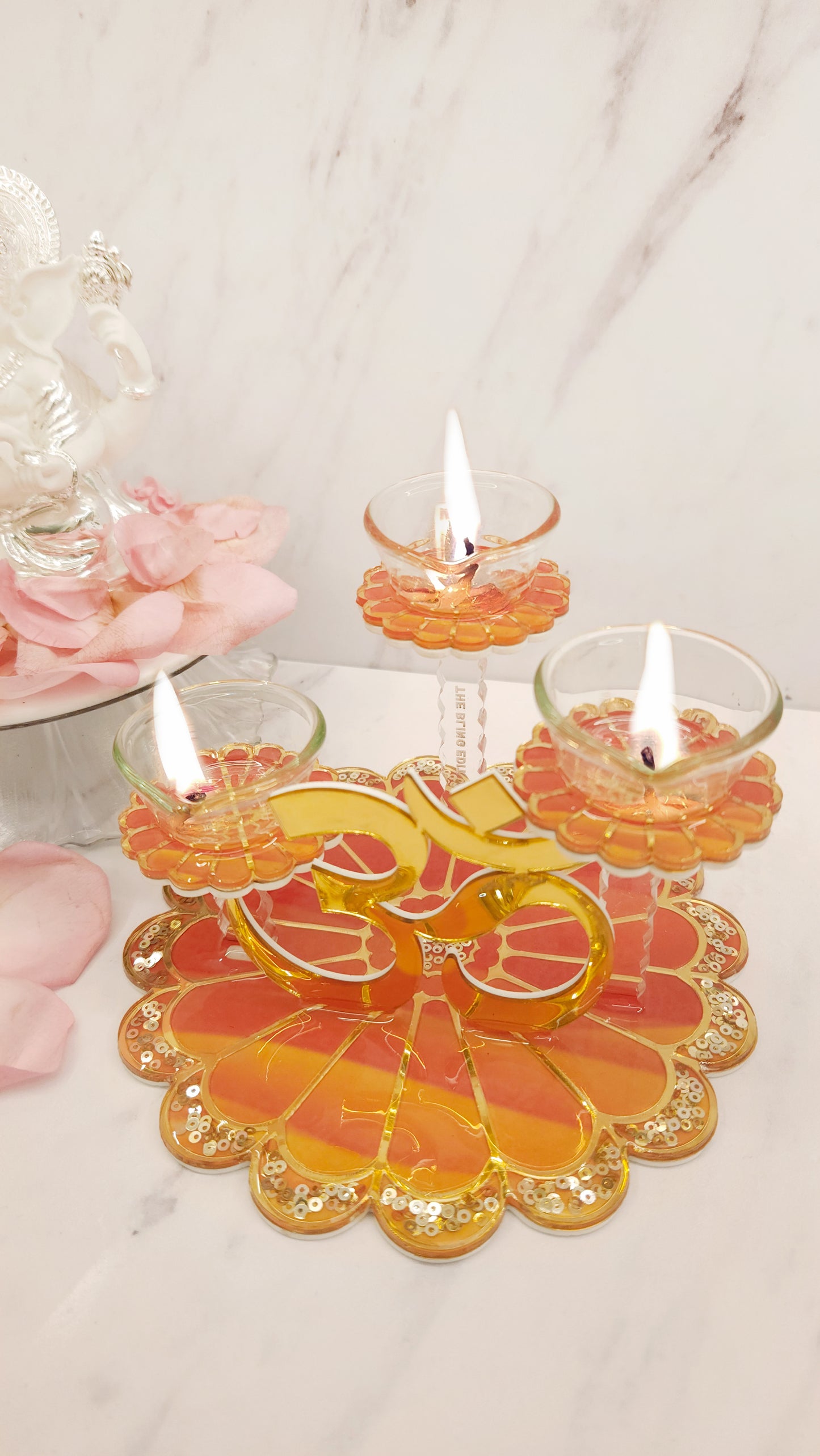 Sunset Bloom: Om 3 Stand Diya